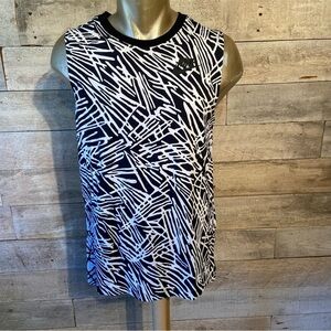 Nike  women’s white & black sleeveless shirt in‎ size small